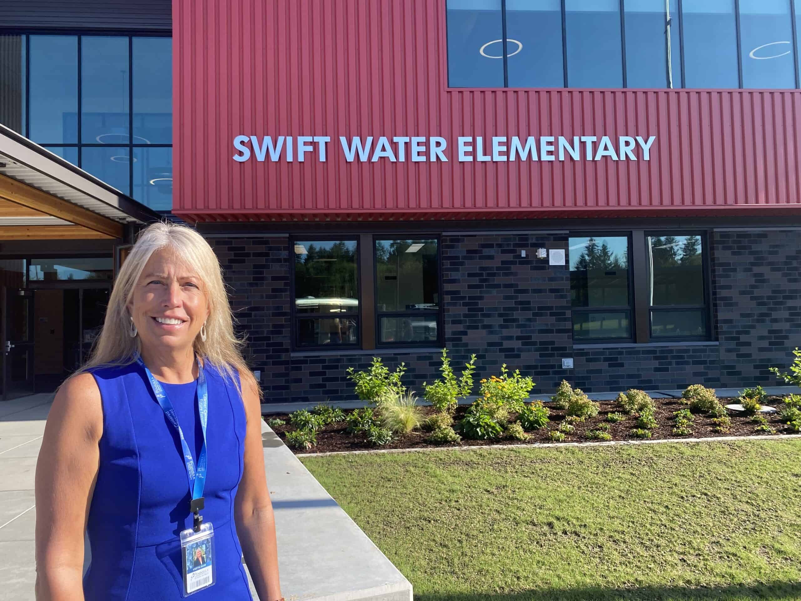 Krestin Bahr, Peninsula School District’s new superintendent, stands in front of the new Swift Water Elementary School