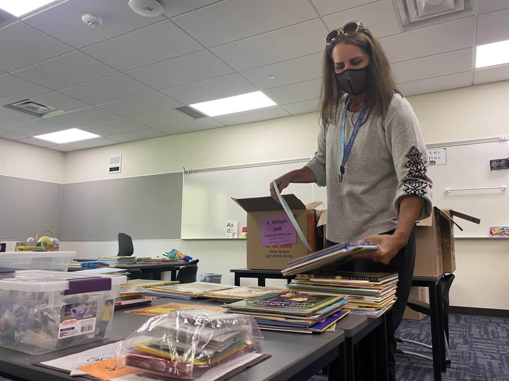 Kindergarten teacher Kelli Willson sets up her classroom at the new Swift Water Elementary School.