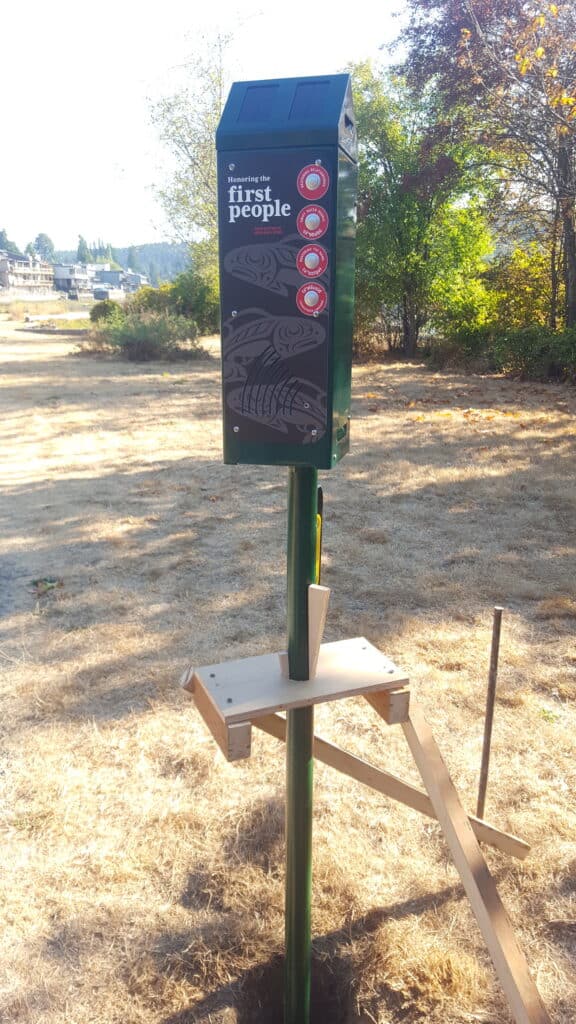 A picture of the voice box that tells a brief history of the estuary being installed at Austin Park.