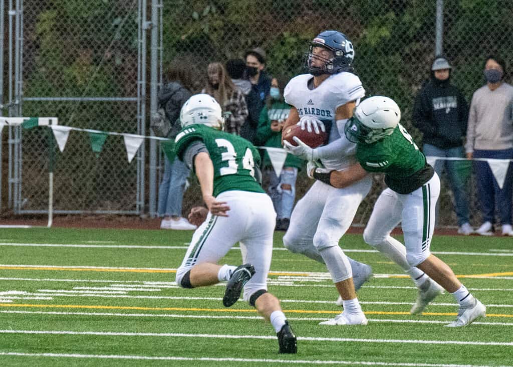 Gig Harbor's Colin Montgomery hauls in a pass from Will Landram.