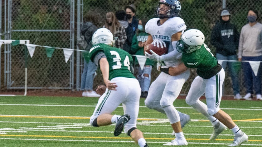 Gig Harbor's Colin Montgomery hauls in a pass from Will Landram.