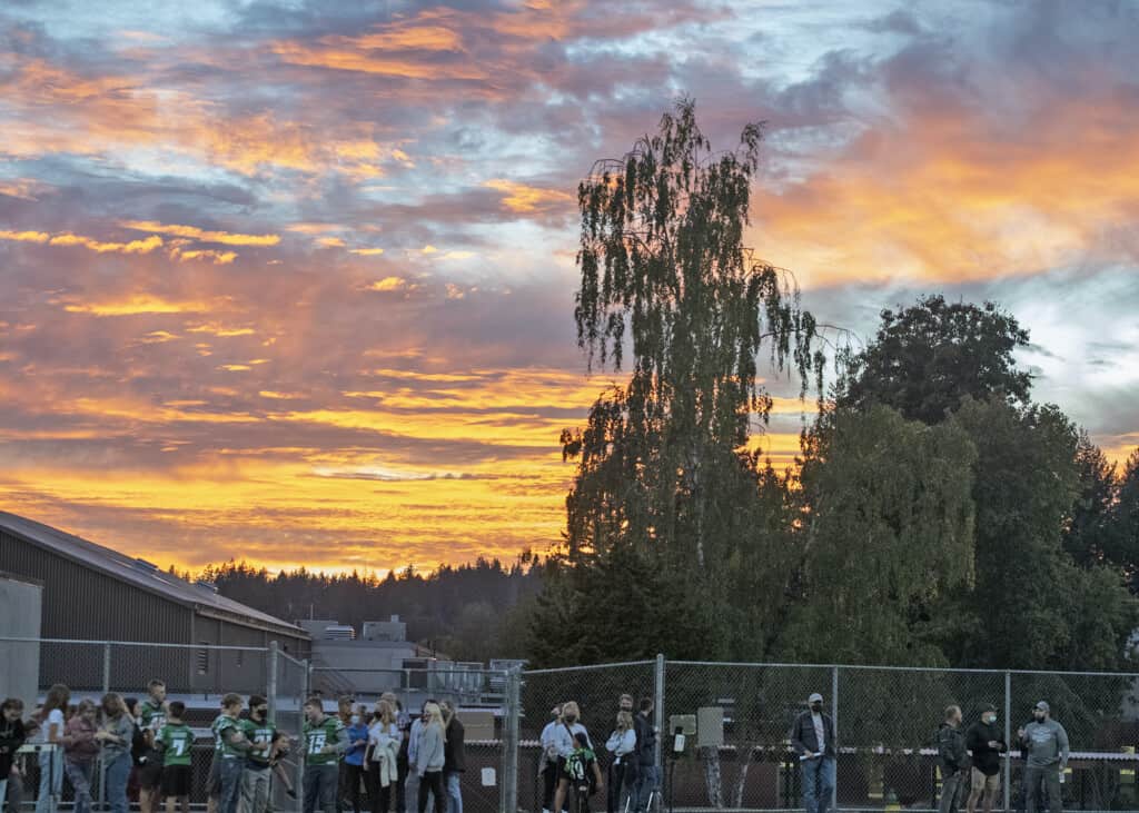Sun sets behind the Peninsula football field in Purdy before Friday's game.