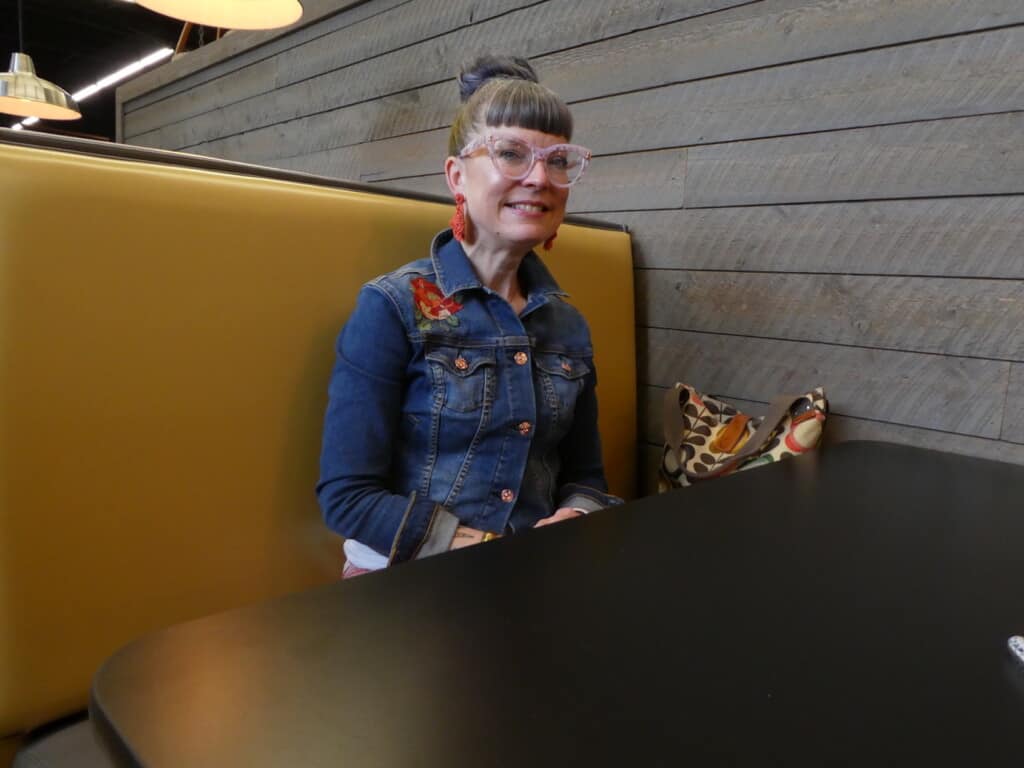 Manager of new Metropolitan Market in Gig Harbor sits in a booth during a recent interview.