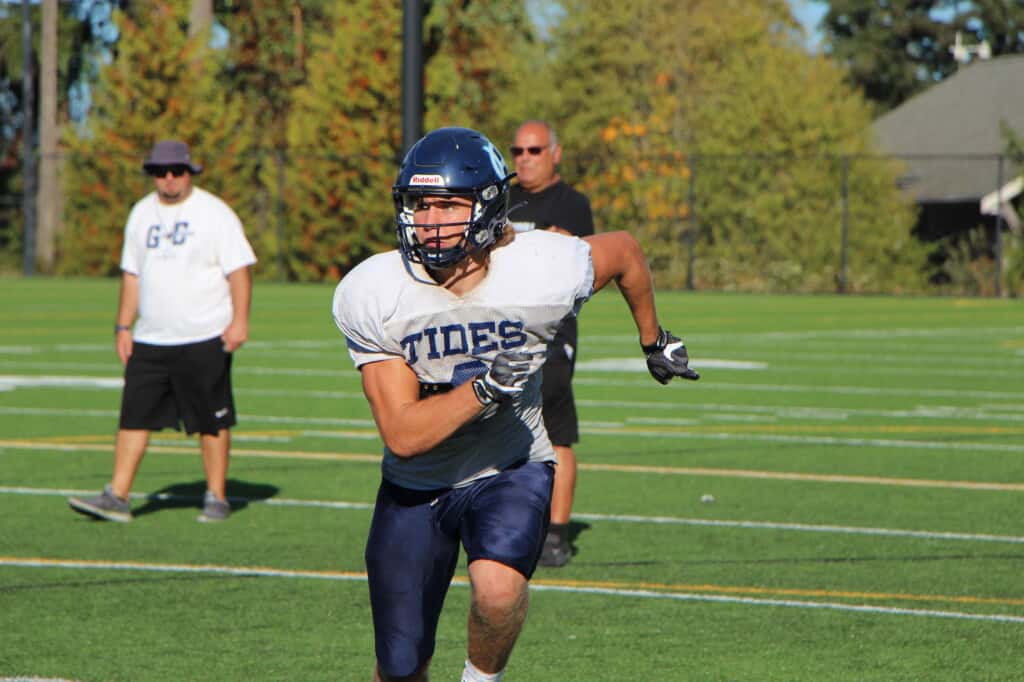 Gig Harbor linebacker/wide receiver Hudson Cedarland practices on the Tides' field.