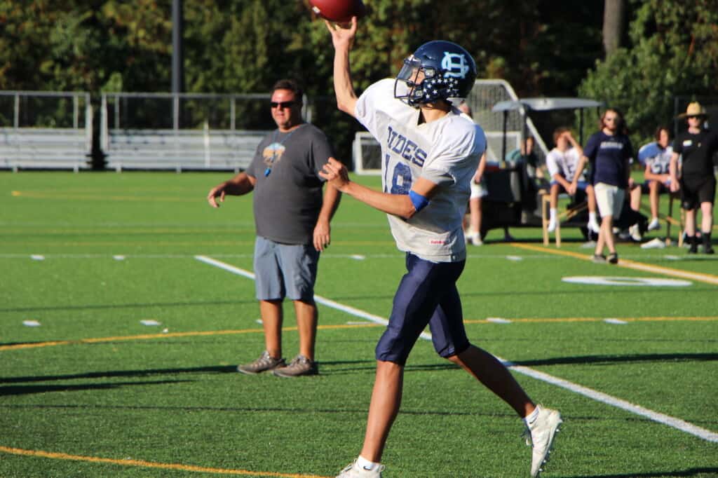 Gig Harbor Will Landram tosses a pass during practice