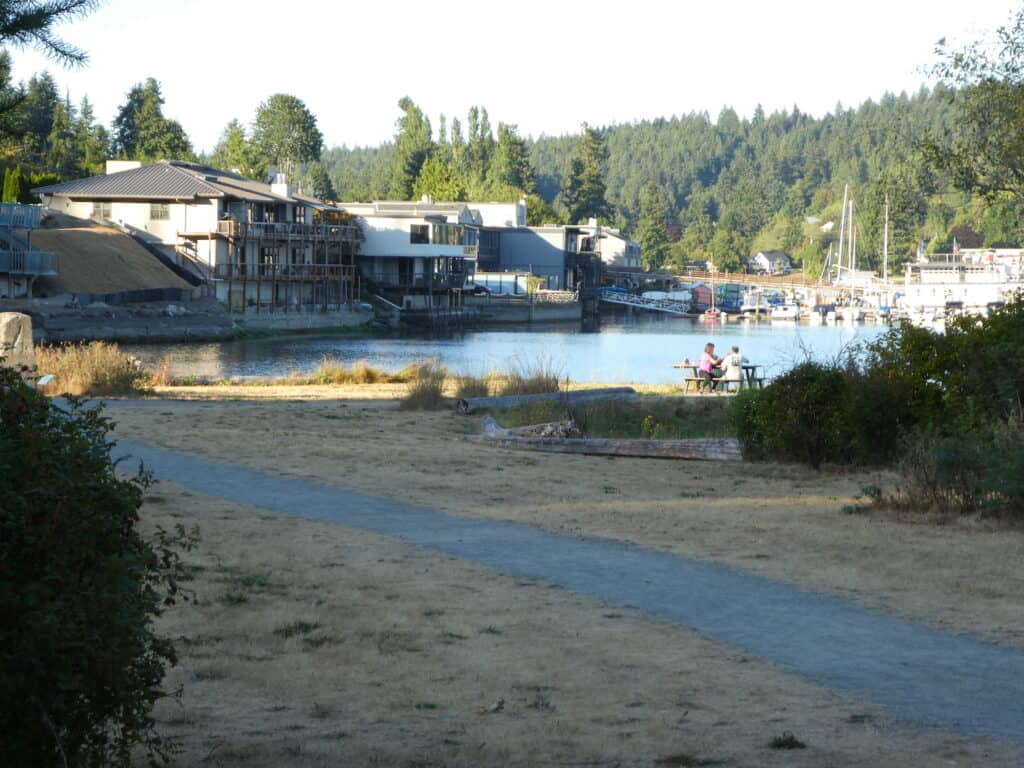 Visitors at a picnic table enjoy Gig Harbor's Austin Park where signs will soon be erected that tell the early history