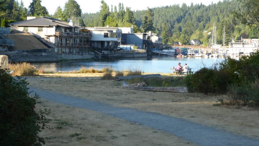 Visitors at a picnic table enjoy Gig Harbor's Austin Park where signs will soon be erected that tell the early history