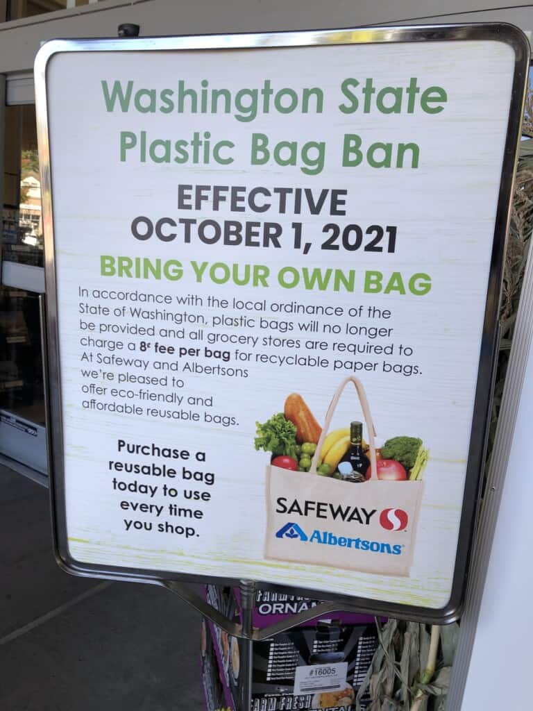 A sign outside of the Gig Harbor Albertsons alerts shoppers that beginning Friday they'll need to start using reusable bags again.