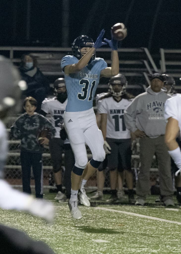 Gig Harbor's Benjamin Stevens goes up for a catch.