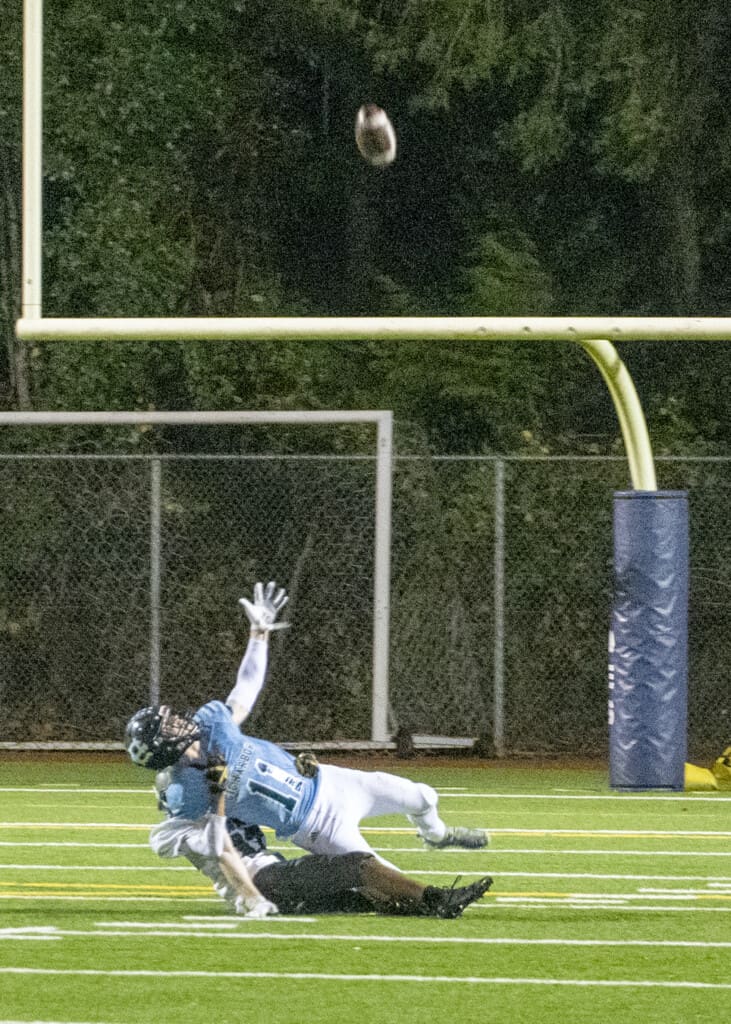 Gig Harbor's Cole Rushforth is tackled while reaching for a pass.