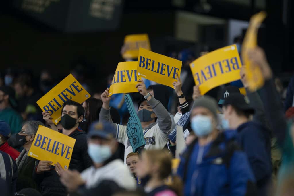 Fans wave placards of "Believe," the Mariners motto during their playoff chase.