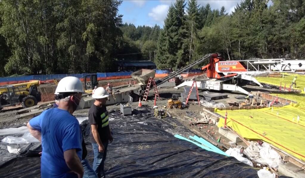 FISH board president Ron Coen (left) gets an update on construction of the new FISH facility.