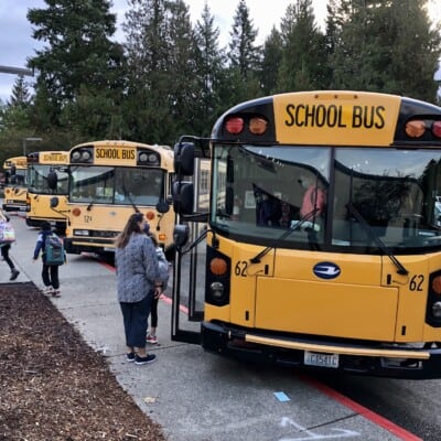 A bus drops off students at Gig Harbor High School