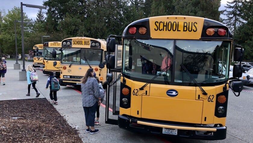 A bus drops off students at Gig Harbor High School