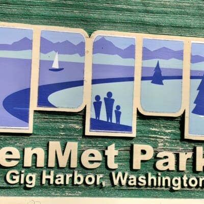 A carved PenMet Parks sign