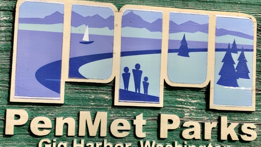 A carved PenMet Parks sign