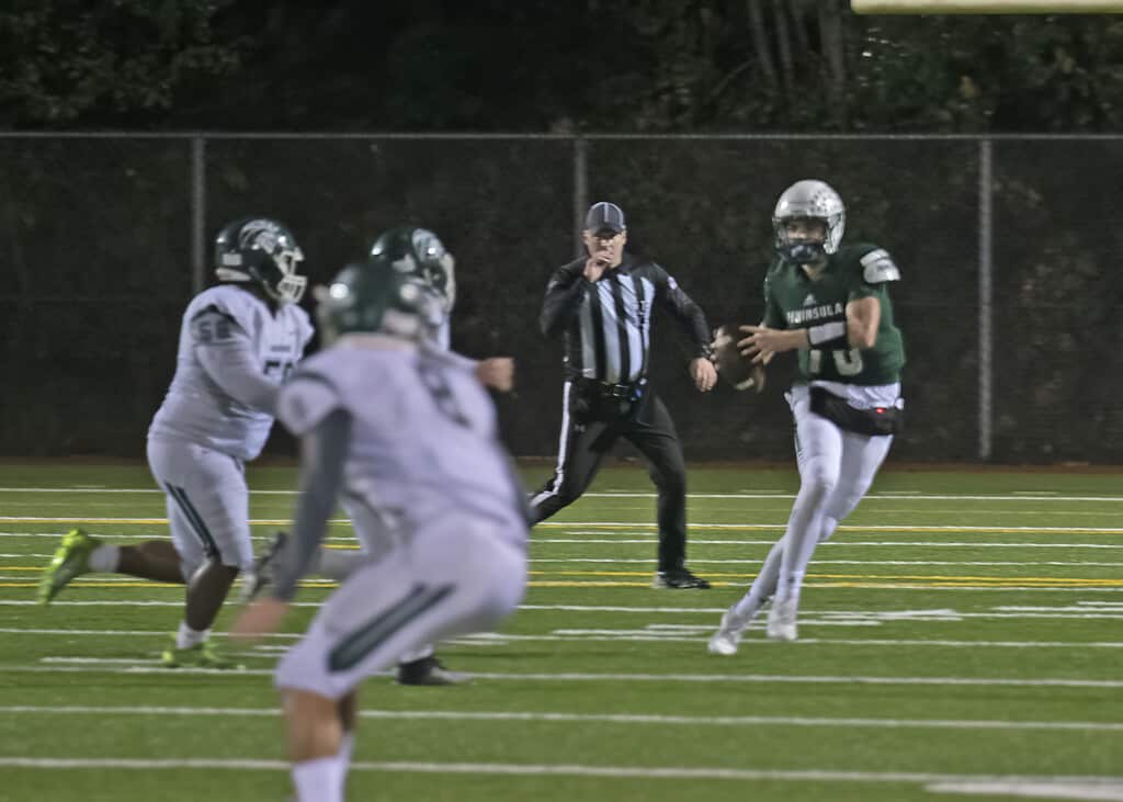 Peninsula quarterback Jake Bice looks for a receiver.