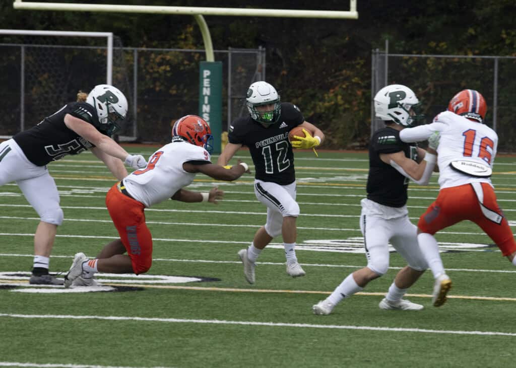 Peninsula running back Josh Hinkel darts toward a hole.