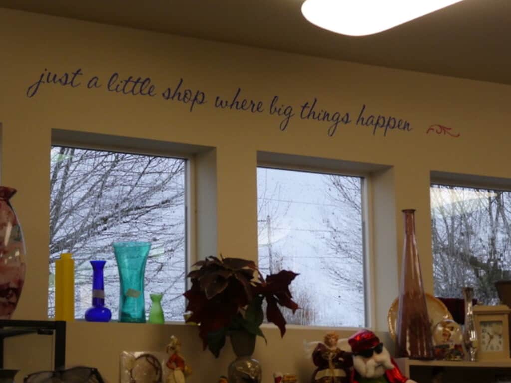 Sign at thrift shop reads “just a little store where big things happen."