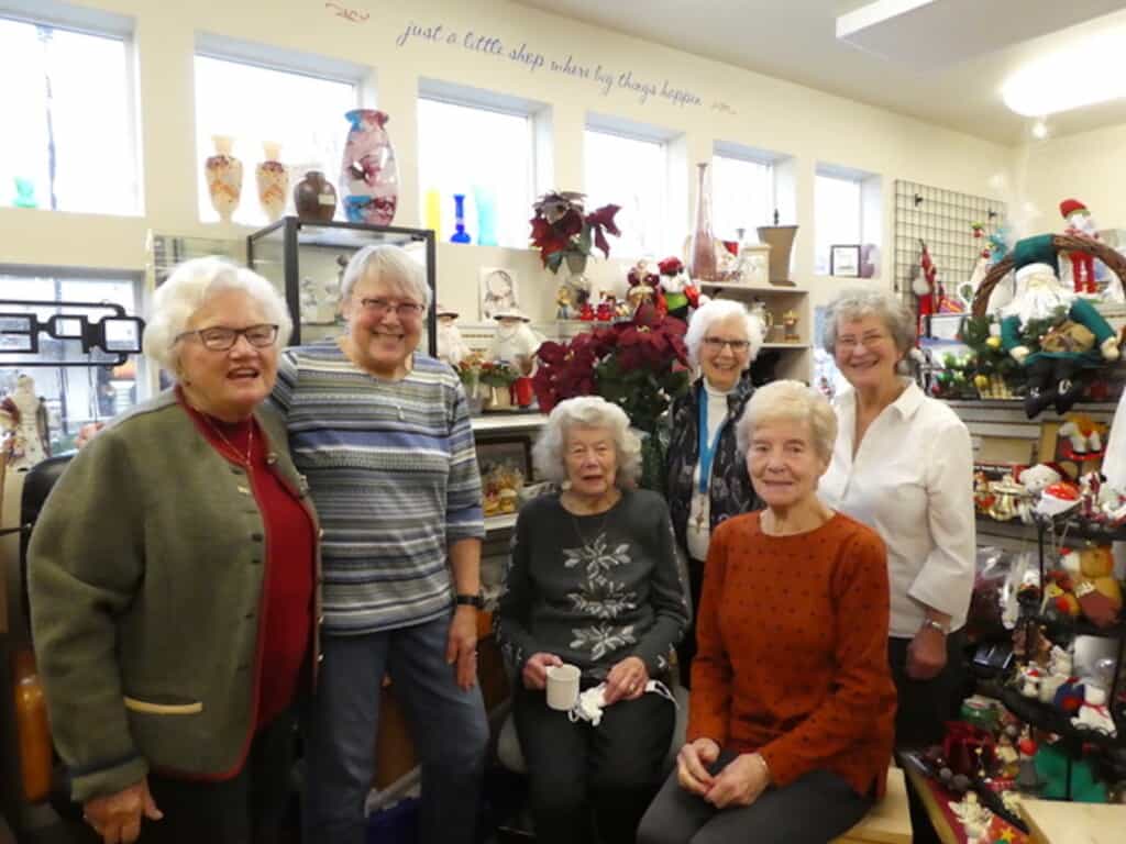 Six women who have volunteered at the thrift shot nearly 200 years.