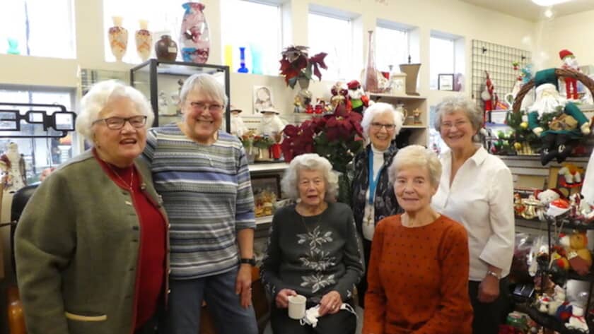 Six women who have volunteered at the thrift shot nearly 200 years.