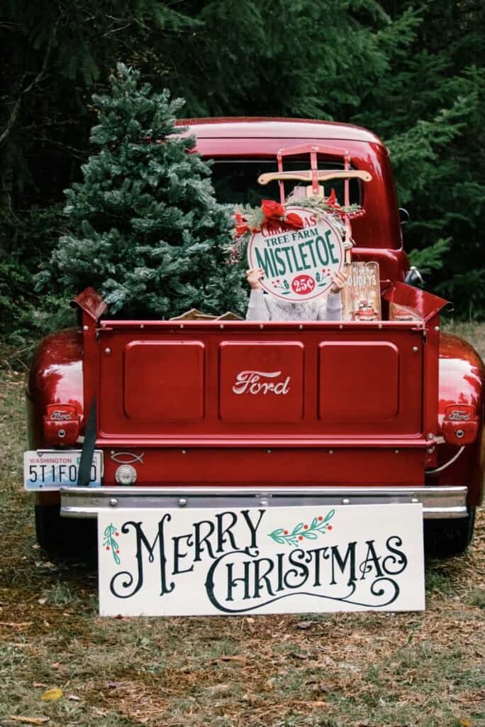 Olalla photographer Jess Luster will be at the store parking lot Saturday to take pictures by donation — with her Red Xmas Truck