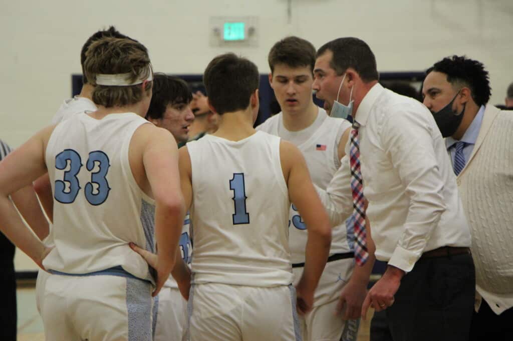 Coach Billy Landram exhorts his Tides during a timeout on Wednesday.