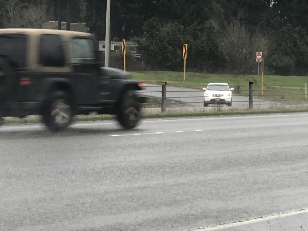 Car entering Highway 16 from Wollochet Drive on-ramp