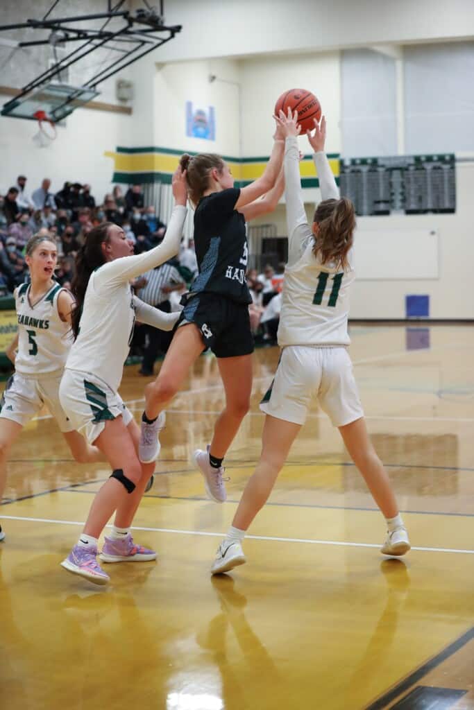 Brooke Zimmerman, Makenna Smith and #5 Riley Redal play tough Seahawk defense