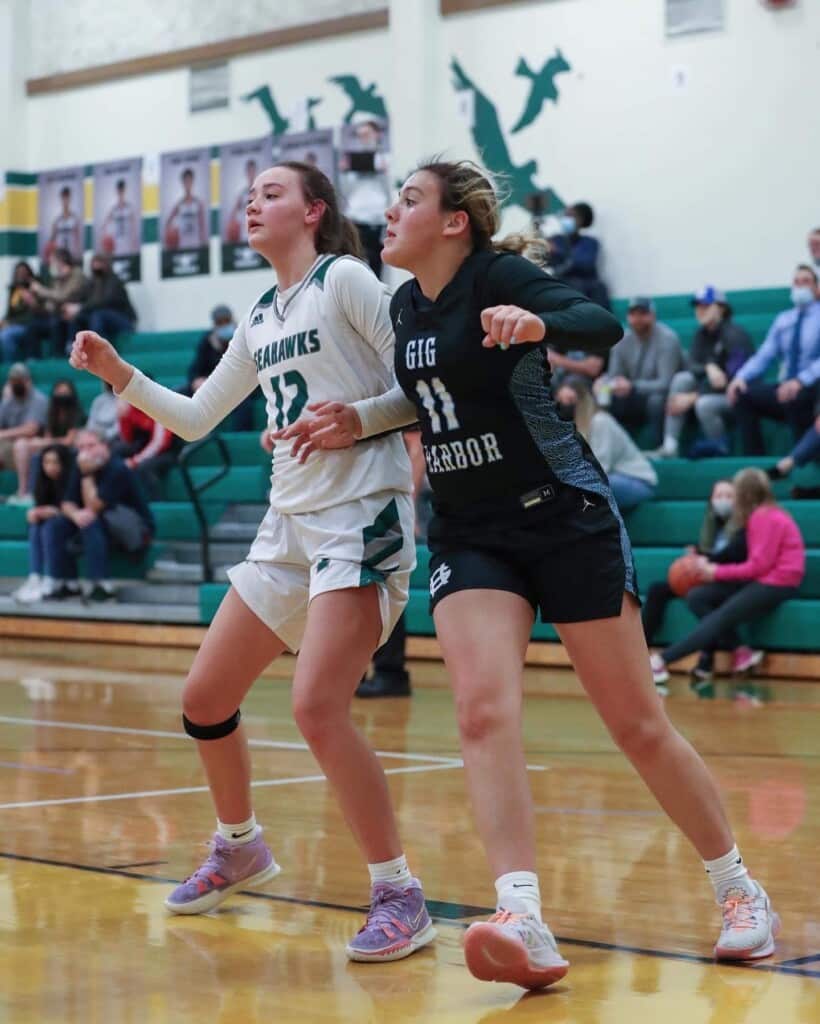 Peninsula's Makena Smith battles for a rebound. The Seahawks claimed the league's No. 3 playoff seed.