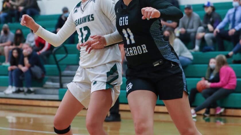 Peninsula's Makena Smith battles for a rebound. The Seahawks claimed the league's No. 3 playoff seed.