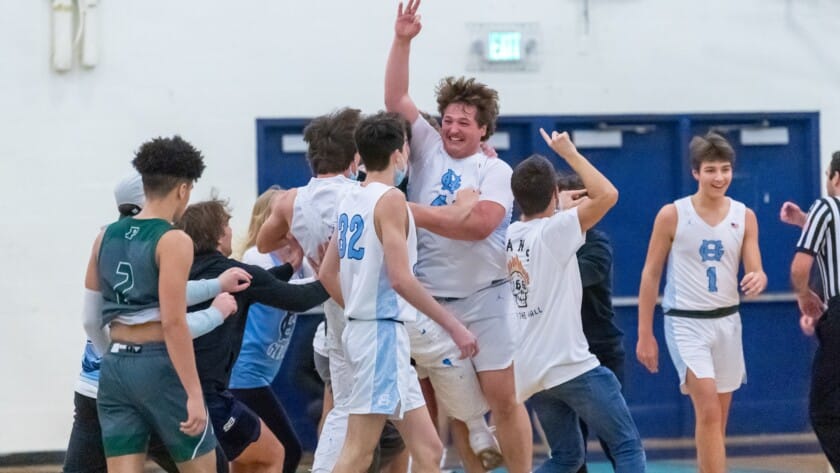 Nic Fortney celebrates his first career 3 as he is mobbed at center court