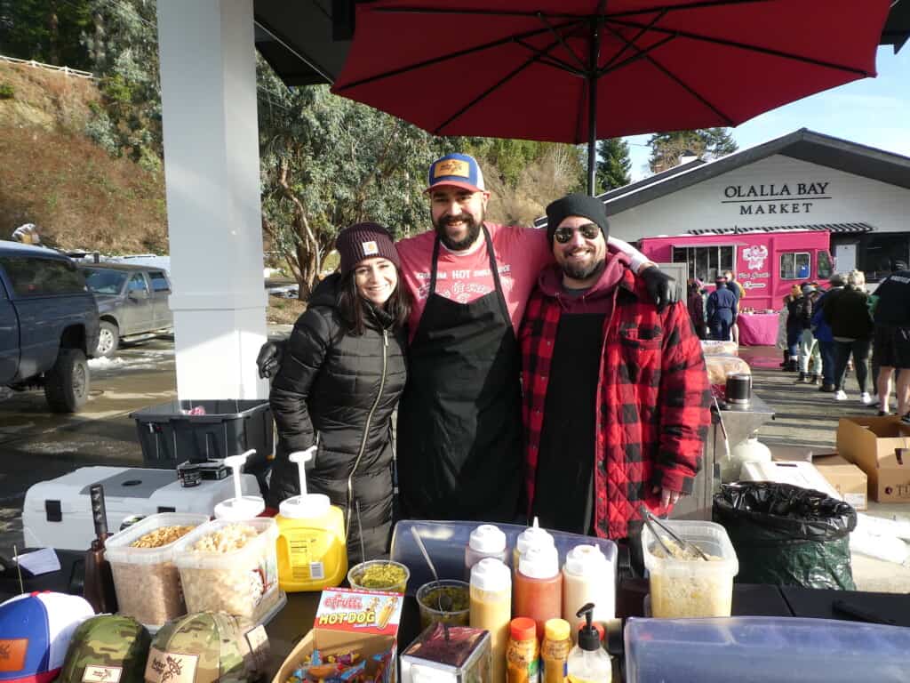 HauteDogs crew (l-r) Megan Marshall, Alex Marshall and Guy Storz celebrated their first day of business at the Olalla Polarbear Jump