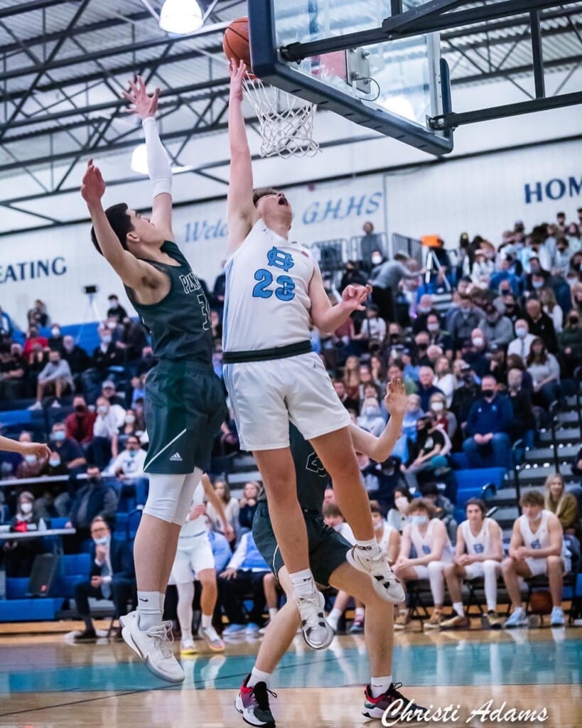 Luke Browne goes up for two while Ethan Stout defends.