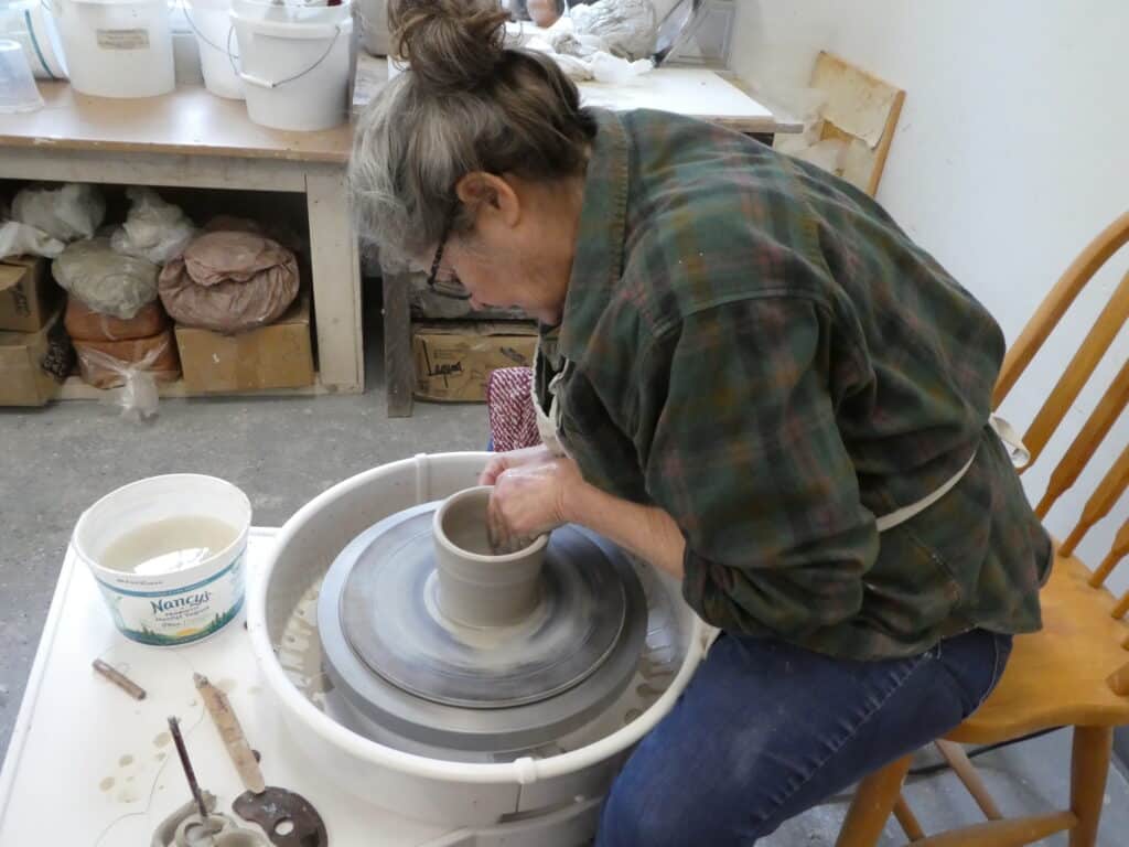 Olalla potter Jana Fisher is a regular contributor to the Empty Bowls project. Here's she's throwing a pot for this year's event