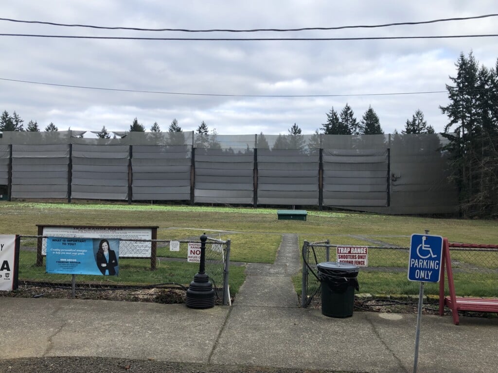 A 50-foot-high, 500-foot wide, thick fabric wall blocks and contains shotgun ammo.