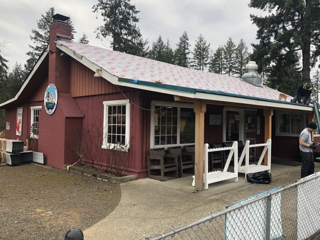 The clubhouse was built in 1950 in a unique vertical log style.