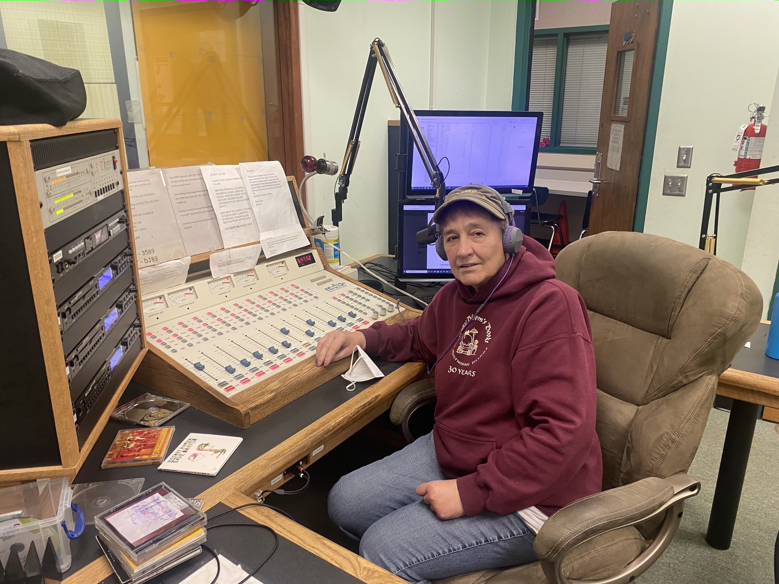 Betty Devereux, host of BD’s Books and Friends, takes a break from broadcasting her show at KGHP-FM on Thursday