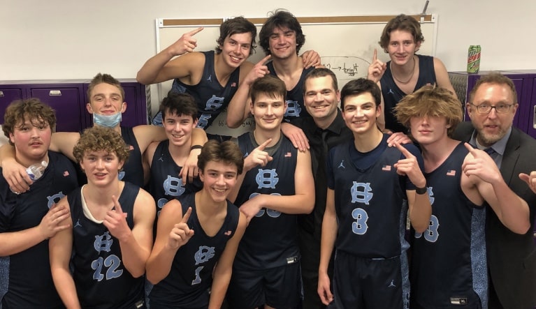 The Gig Harbor Tides celebrate their South Sound Conference championship earlier this season. The tight-knit squad earned a bye into the state tournament quarterfinals and open play in the Tacoma Dome at 12:15 p.m. Thursday, March 3.