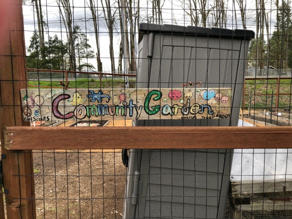 A local Girl Scout troop created this sign for the community garden at Wilkinson Farm Park.