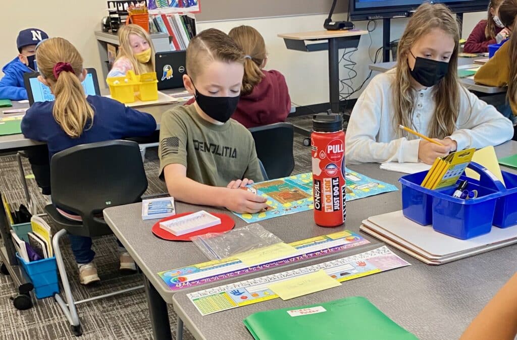 Students at Artondale Elementary on Nov. 22, 2021, wear masks in compliance with the state’s school mask mandate. The state’s indoor mask mandate will expire March 12, 2022, including in schools.