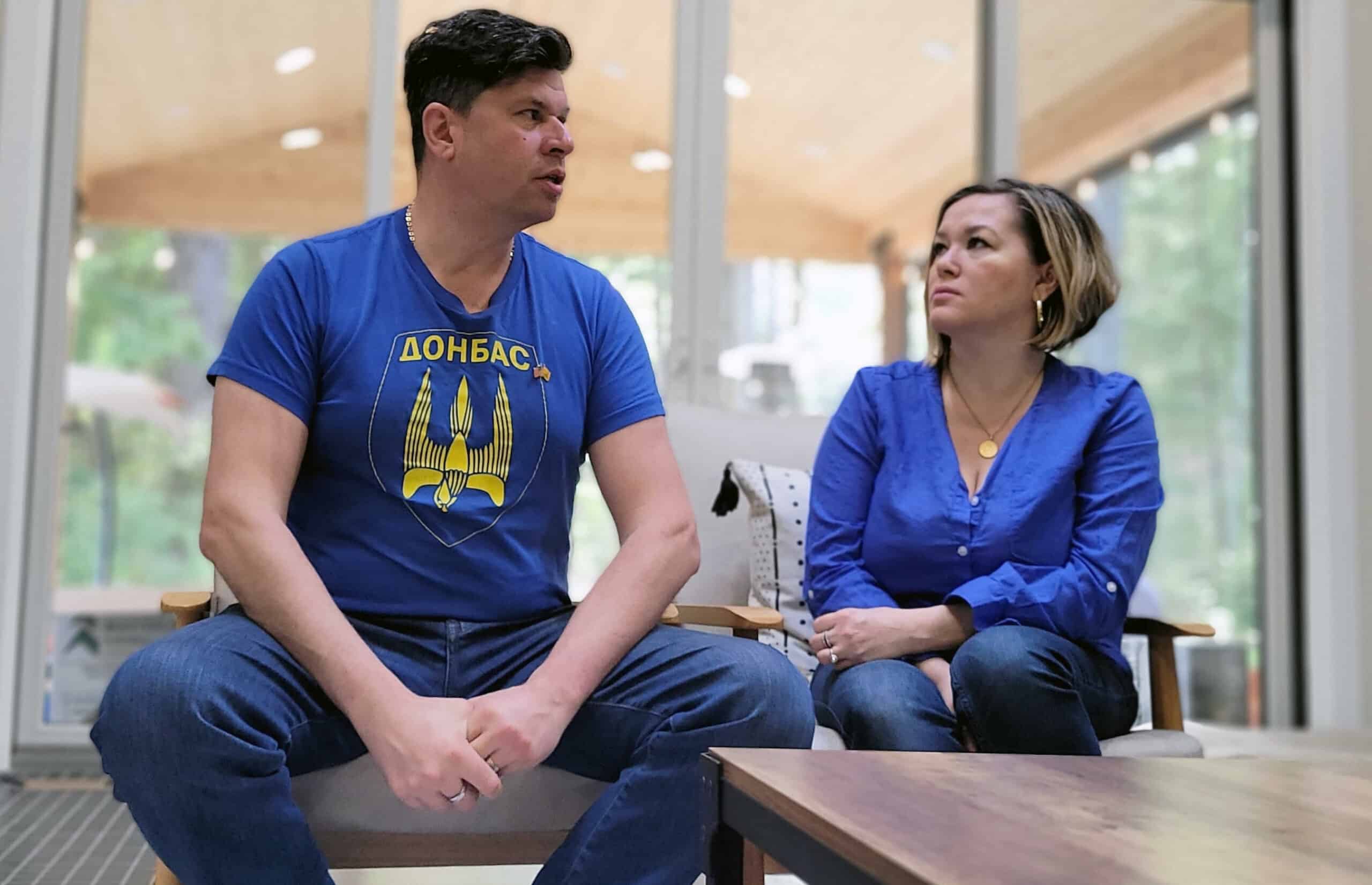 Andrey and Natasha Petrenko discuss the war in Ukraine in their Gig Harbor living room. Andrey's shirt bears the name of Donbas, a region of Ukraine that was central to Russia's illegitimate pretext for invading. Andrey said his family roots are in the Donbas area.