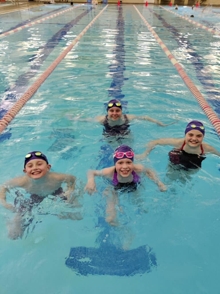 Tom Taylor YMCA Seals swim team members who qualified for regionals are, from left, Henry Schlicher, Madison Ragulsky and Lee Gjertson and, in back, Amelia Evans.