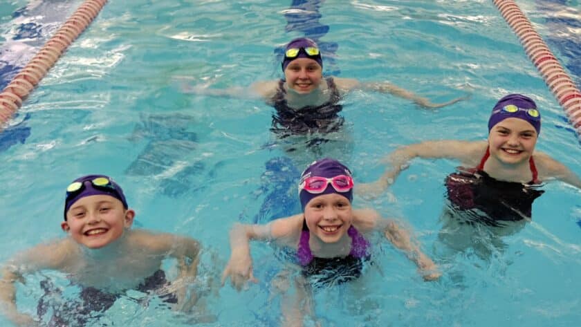 Tom Taylor YMCA Seals swim team members who qualified for regionals are, from left, Henry Schlicher, Madison Ragulsky and Lee Gjertson and, in back, Amelia Evans.
