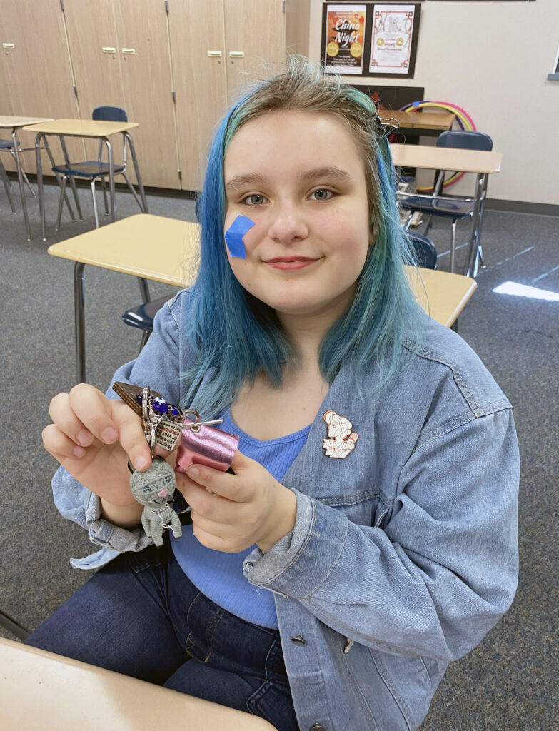 Chinese language student Izaer Marquez shows off “Winston,” their keychain ornament similar to the keychain “dolls” (娃娃 pronounced "wá wa”) that are popular among students at Taipei Municipal Zhong-Lun High School in Taiwan. Students from Peninsula School District have an online cultural exchange forum with students at the school in Taiwan.