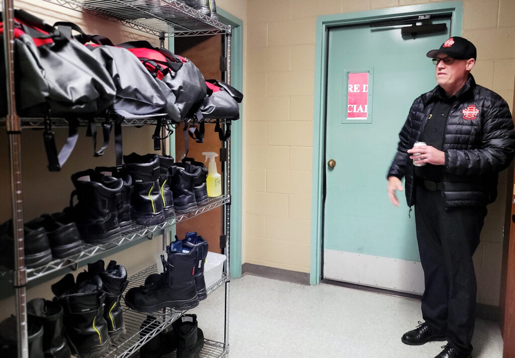 Gig Harbor Fire and Medic One Chief Dennis Doan in a gear storage room used by firefighters at Station 58.