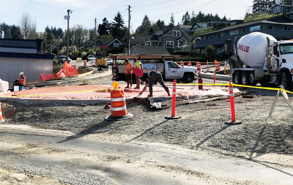 Contractors working on the Harborview Drive-Stinson Avenue roundabout are on track to get two-way traffic flowing through the intersection as soon as late May. If the weather turns bad, the project could be delayed, however.