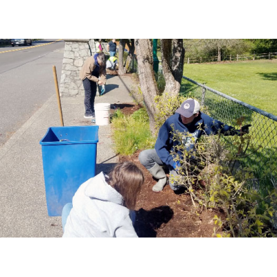 Volunteers pull weeds during a previous Parks Appreciation Day.