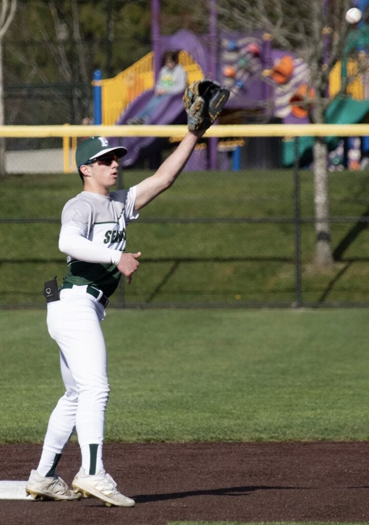 Second baseman Ben King reaches for a ball to force out a runner trying to advance.