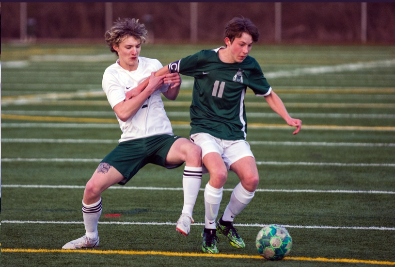 Senior Cory Burbridge controls the ball while being held by a Timberline player. The Blazers didn’t hold enough as they lost to the Seahawks 5-0.